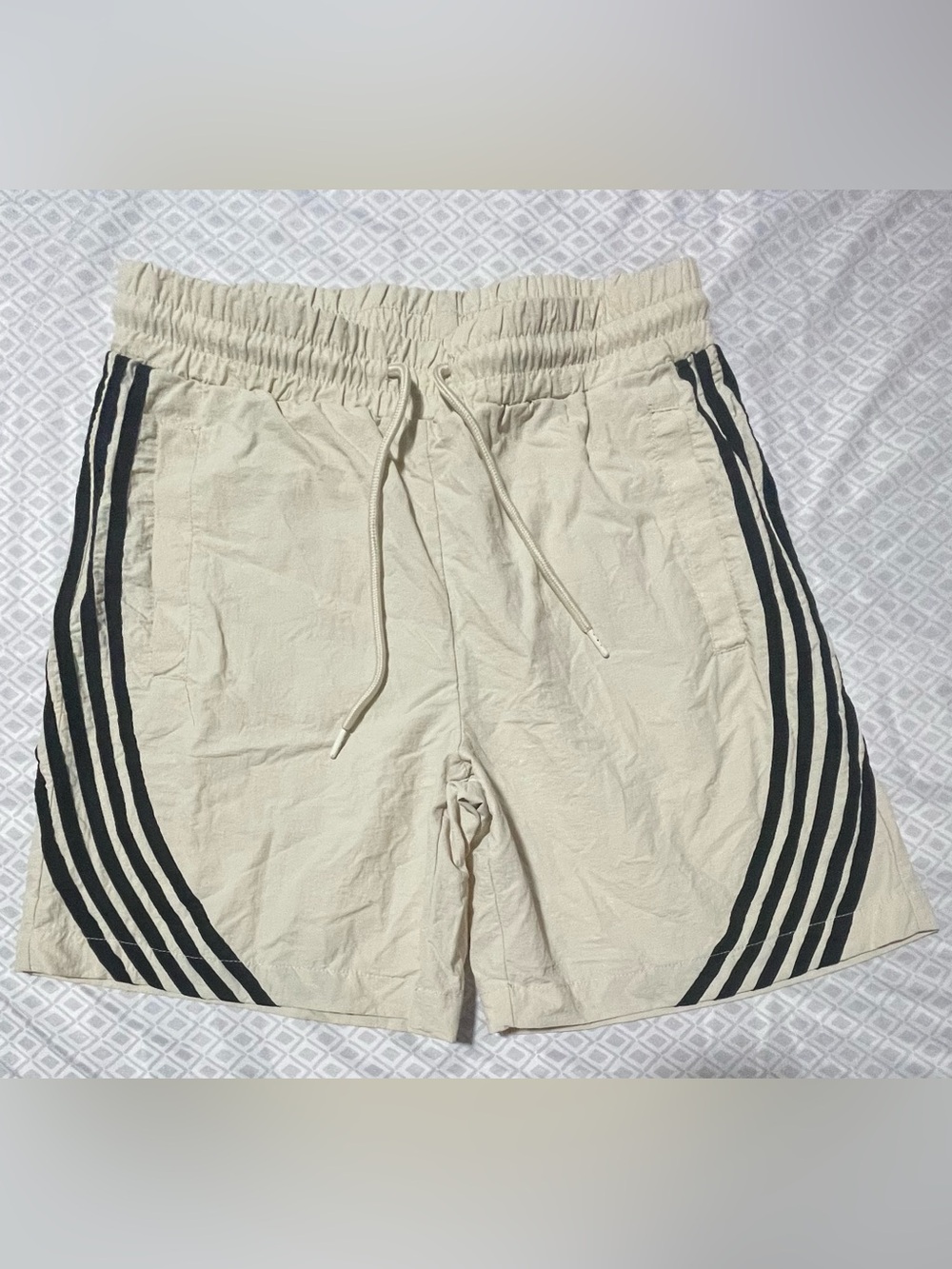 Cream Athletic Shorts with Black Side Stripes and Drawstring